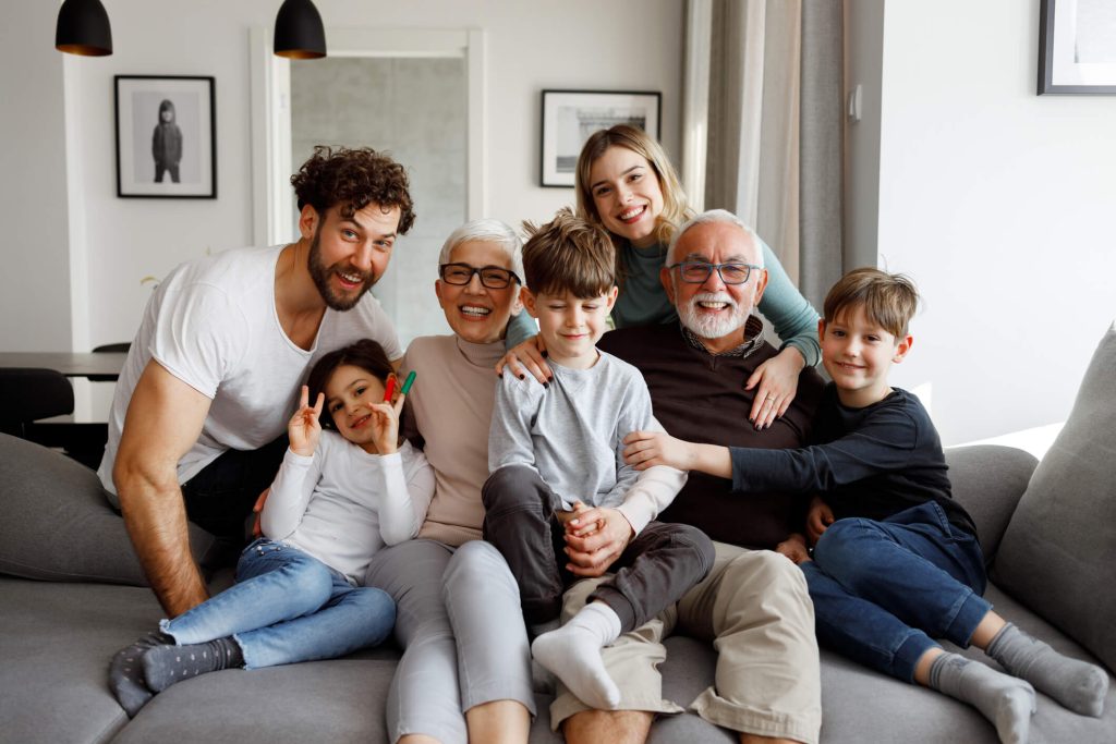 Happy family gathered together on couch